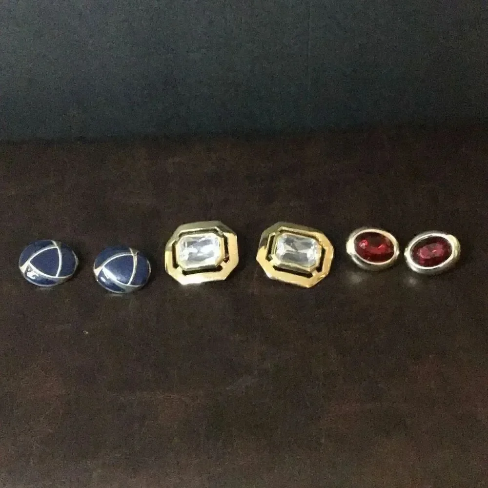 Three pair of various colored Clip on earrings